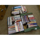Three small boxes of music CDs and DVDs