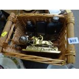 Wicker basket containing electroplate, brass letter rack, hip flasks etc