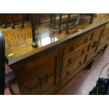 Oak railback sideboard with three centre drawers and two end cupboards