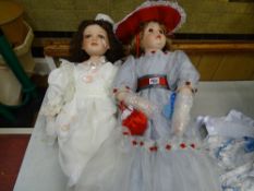 Doll with long hair, cream dress with pink flowers and booties and a doll with long rose adorned