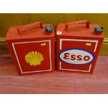 Red painted metal Esso petrol can and a red painted metal Shell petrol can