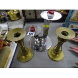 Art Deco chrome candlestick and a pair of Art Nouveau brass candlesticks