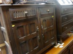 Priory style three drawer writing bureau and a small two drawer, two door cupboard
