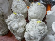 Parcel of four seated lion garden ornaments