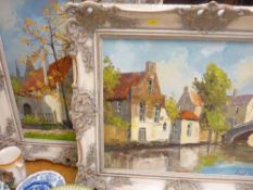 Two oils on canvas - country village scenes in vintage style colourwash frames, indistinctly signed