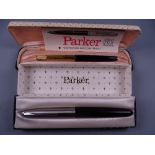 Vintage black Parker 61 fountain pen with rainbow RG cap, in original box with instructions and a