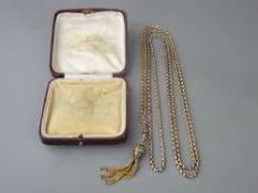 A VICTORIAN NINE CARAT GOLD CHAIN with tasselled end fob, 80 cms long overall, 34 grms gross