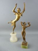 AN ART NOUVEAU BRONZE FIGURINE OF A NAKED FEMALE with cup in hand on a square onyx base with a