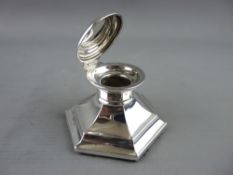 A HEXAGONAL SILVER INKWELL with loaded base, Chester 1912