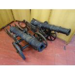 A PAIR OF ORNAMENTAL CAST IRON CANONS, 160 cms long