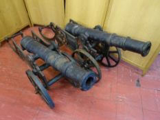 A PAIR OF ORNAMENTAL CAST IRON CANONS, 160 cms long