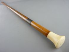 A MALACCA SWORDSTICK with ivory/bone grip and brass mounts, 50 cms long, the near square blade, 93