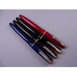 Four Vintage Parker Slimfold fountain pens (two black, one blue, one red), all with 14k nibs