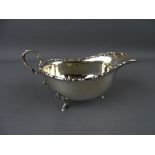 A SILVER SAUCE BOAT on three hoof feet, 16 cms long, London 1919, 3 troy ozs