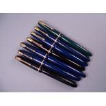 Six Vintage Parker Slimfold fountain pens (two black, four blue) and one Junior, all with 14k nibs