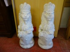 A PAIR OF RECONSTITUTED STONE & PAINTED REGAL GARDEN LIONS, 67 cms high