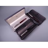 Vintage black Parker 51 fountain pen with stainless steel cap in box and two Vintage burgundy Parker