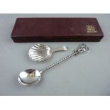 A SILVER CADDY SPOON with scallop shell bowl and bright cut tapered handle by George Burrows,