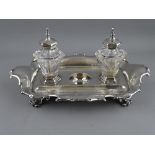 A VICTORIAN SILVER INKSTAND with hexagonal glass ink bottles, Barnard Brothers makers, London
