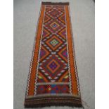 A Suzni Kilim runner colourful, multi diamond pattern with chequered border 240 x 75cms