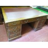 A CIRCA 1900 MAHOGANY PARTNER'S DESK with inset red leather top, 75.5 cms high, 151 cms wide, 121.