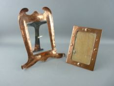 TWO ARTS & CRAFTS COPPER PORTRAIT FRAMES, one stamped 'Newlyn' with front shell decoration, 17 x