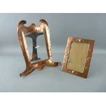 TWO ARTS & CRAFTS COPPER PORTRAIT FRAMES, one stamped 'Newlyn' with front shell decoration, 17 x