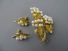 A NINE CARAT GOLD LEAF BROOCH, 8.6 grms, London 1910, encrusted with thirty one pearls and a pair of