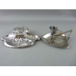 AN ART NOUVEAU WMF PLATED INKWELL and a similarly styled chamberstick (unmarked)