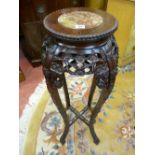 A CHINESE CARVED HARDWOOD STAND with inset marble top, 93 cms high, 28 cms diameter top