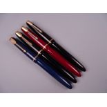 Four Vintage Parker Slimfold fountain pens (two black, one blue, one red), all with 14k nibs