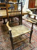 A RUSH SEATED ELM LANCASHIRE SPINDLEBACKED CHAIR