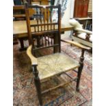 A RUSH SEATED ELM LANCASHIRE SPINDLEBACKED CHAIR