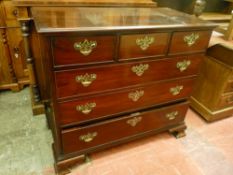 A CIRCA 1800 MAHOGANY CHEST of three short over three long drawers, all oak lined with pierced brass