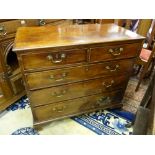 AN EARLY 19th CENTURY MAHOGANY CHEST of two short over three long drawers having pommel plates and