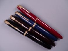Four Vintage Parker Duofold fountain pens (black, blue brown red), all with 14k nibs