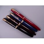 Four Vintage Parker Duofold fountain pens (black, blue brown red), all with 14k nibs