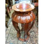 A 20th CENTURY CHINESE CARVED HARDWOOD STAND, 74.5 cms high