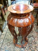 A 20th CENTURY CHINESE CARVED HARDWOOD STAND, 74.5 cms high