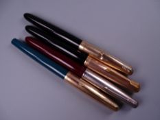 Four Vintage Parker 51 fountain pens (two black, one green, one red)