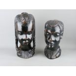 TWO GOOD AFRICAN CARVED WOODEN HEADS, 29 and 24 cms high