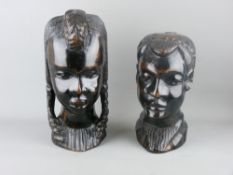 TWO GOOD AFRICAN CARVED WOODEN HEADS, 29 and 24 cms high