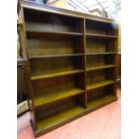 A REPRODUCTION OAK OPEN BOOKCASE with adjustable interior shelves, 152.5 cms high, 165 cms wide,
