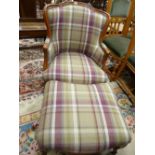 A MODERN FRENCH STYLE ARMCHAIR & FOOTSTOOL in broad check upholstery, 88 cms high, 65 cms wide, 65