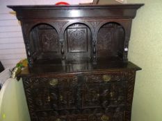 A 19th CENTURY CARVED OAK SMALL HOODED HIGH DRESSER, the upper section having three pillared