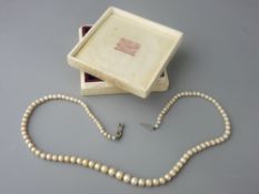 AN 18 ins SINGLE STRAND NECKLACE OF GRADUATED PEARLS with a nine carat white gold clasp, the largest