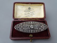 A 935 SILVER OVAL BROOCH encrusted with centre cz and surrounding small czs, 7.9 grms total