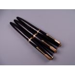 Three Vintage Black Parker Duofold fountain pens including one Maxima, all with 14k nibs