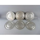 SIX 20.5 cms DIAMETER PEWTER PLATES with foldover rims and matching touch marks