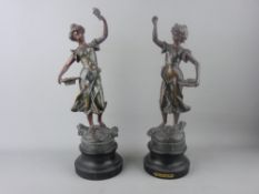 A PAIR OF VICTORIAN SPELTER FIGURINES of young maidens with baskets of flowers on ebonized socle